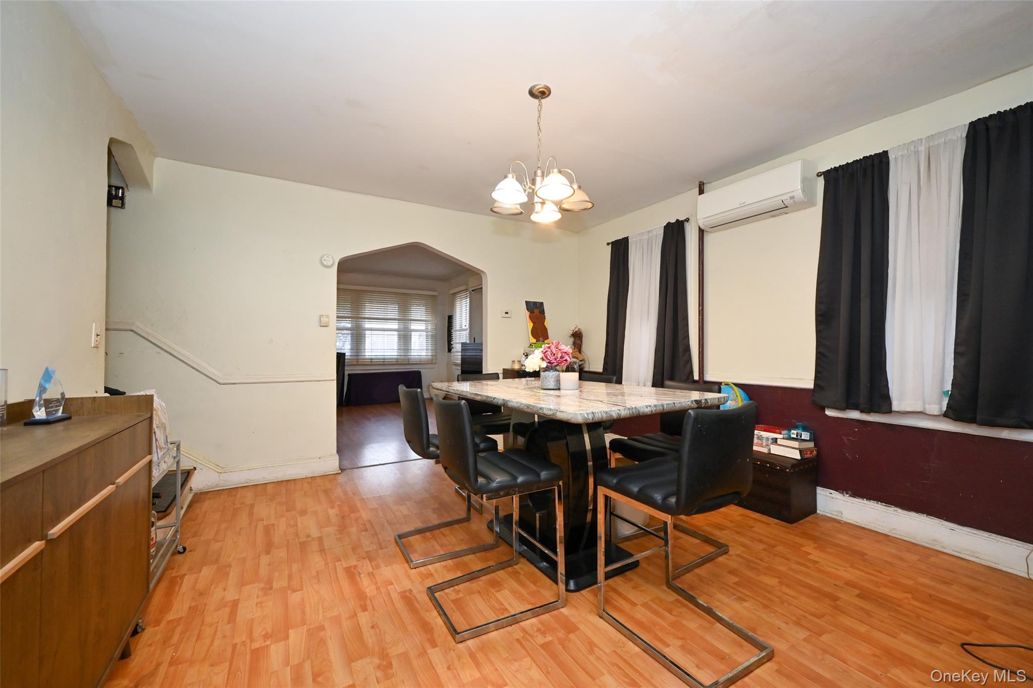 134-21 229th Street Queens, NY 11413 - Photo 10 of 25 a view of a dining room with furniture window and wooden floor