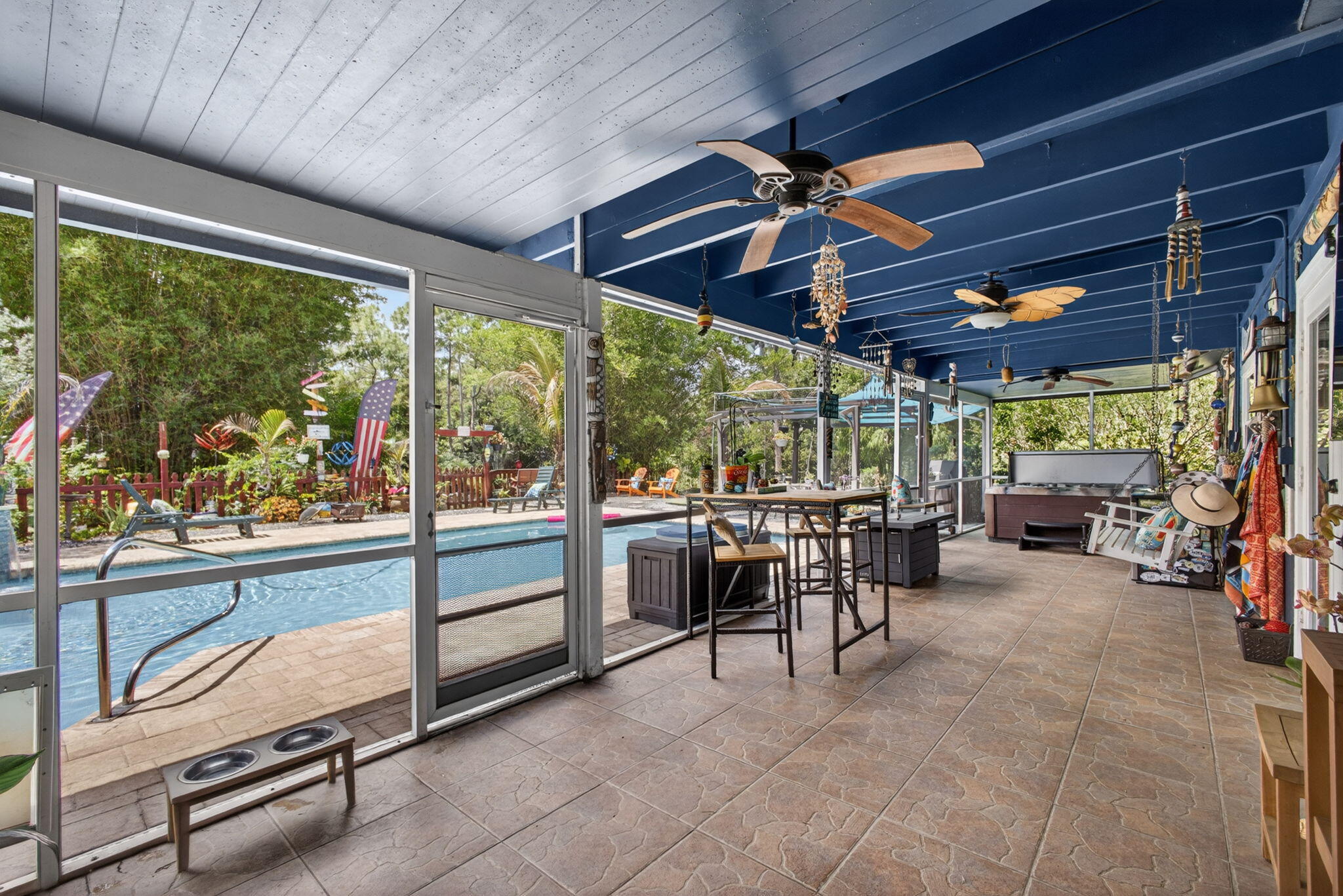 12558 165th Road North Jupiter, FL 33478 - Photo 34 of 67 a view of a porch with furniture and a grill
