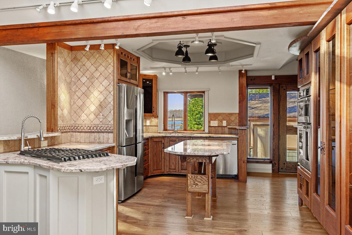 a dining room with furniture and wooden floor