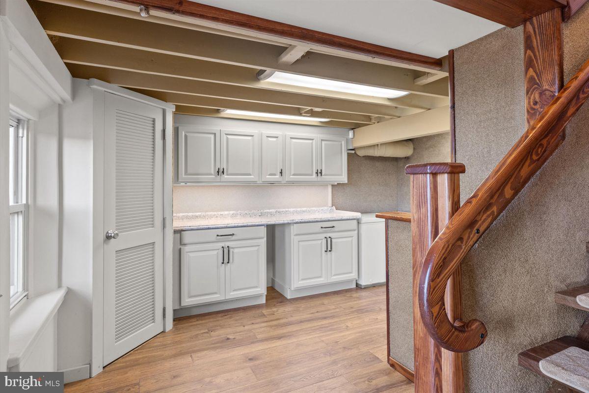 11 Beechnut Lane Willingboro, NJ 08046 - Photo 24 of 29 a kitchen with cabinets and wooden floor