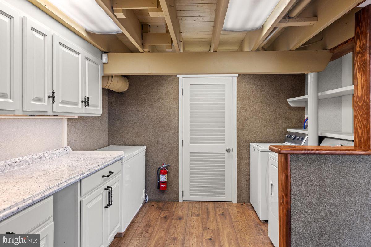 11 Beechnut Lane Willingboro, NJ 08046 - Photo 25 of 29 a kitchen with stainless steel appliances granite countertop a sink stove and cabinets