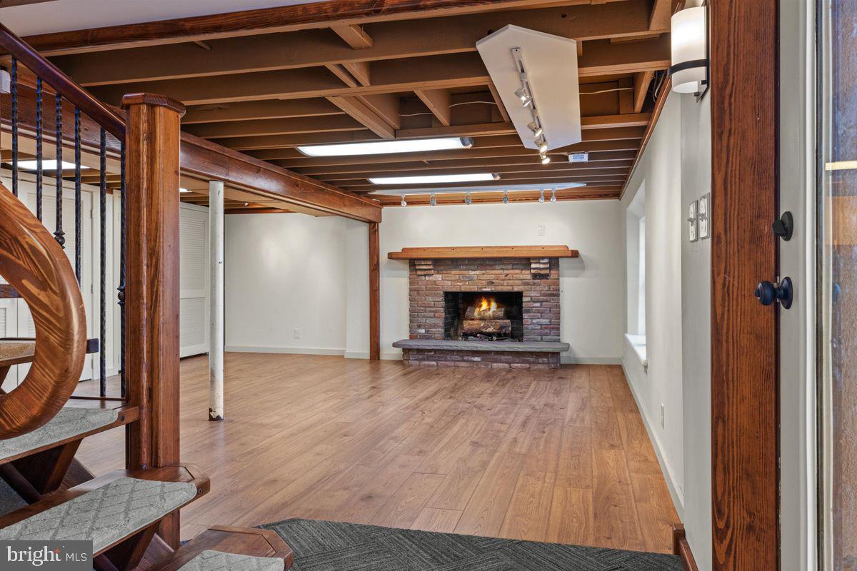 11 Beechnut Lane Willingboro, NJ 08046 - Photo 26 of 29 a view of an empty room with wooden floor a fireplace and a window