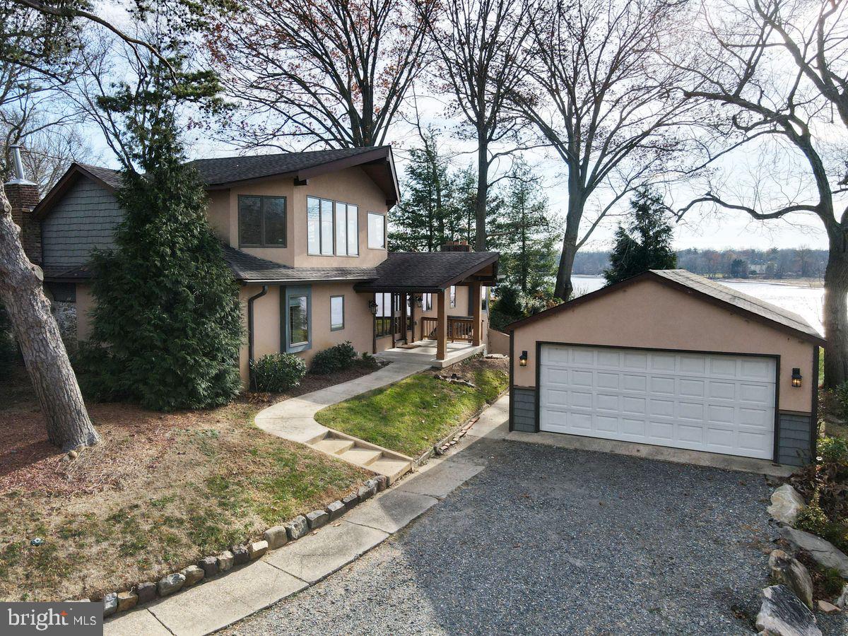 11 Beechnut Lane Willingboro, NJ 08046 - Photo 3 of 29 a front view of a house with a yard and garage