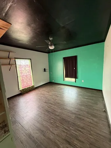 a view of a house with yard and ocean view