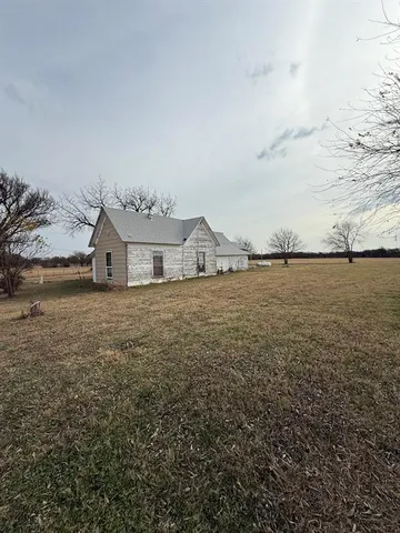 a view of a lake with houses in the back