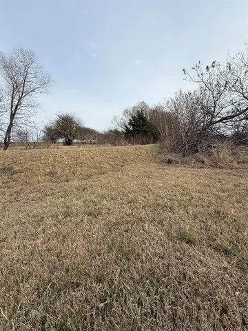 a view of lake with lots of car parked
