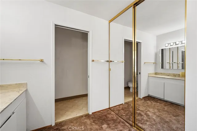 a kitchen with refrigerator a table and chairs