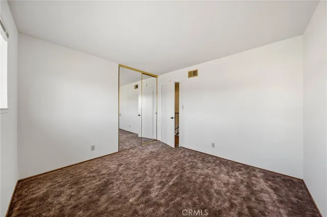 a view of a swimming pool with a lounge chairs