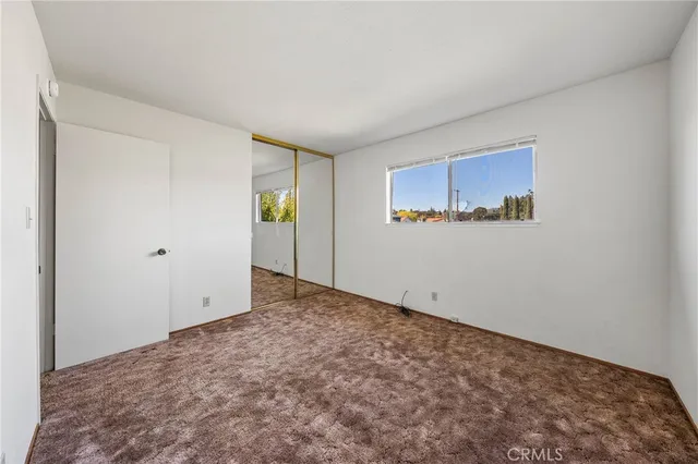 an aerial view of a house with swimming pool having outdoor seating