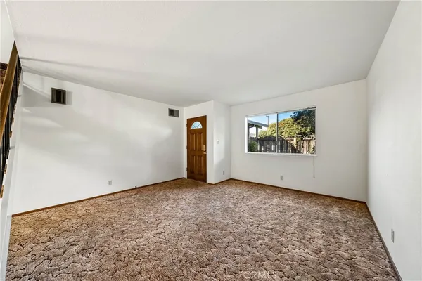 a bed room with a bed and a night stand