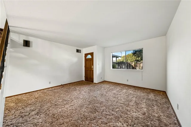 a bed room with a bed and a night stand