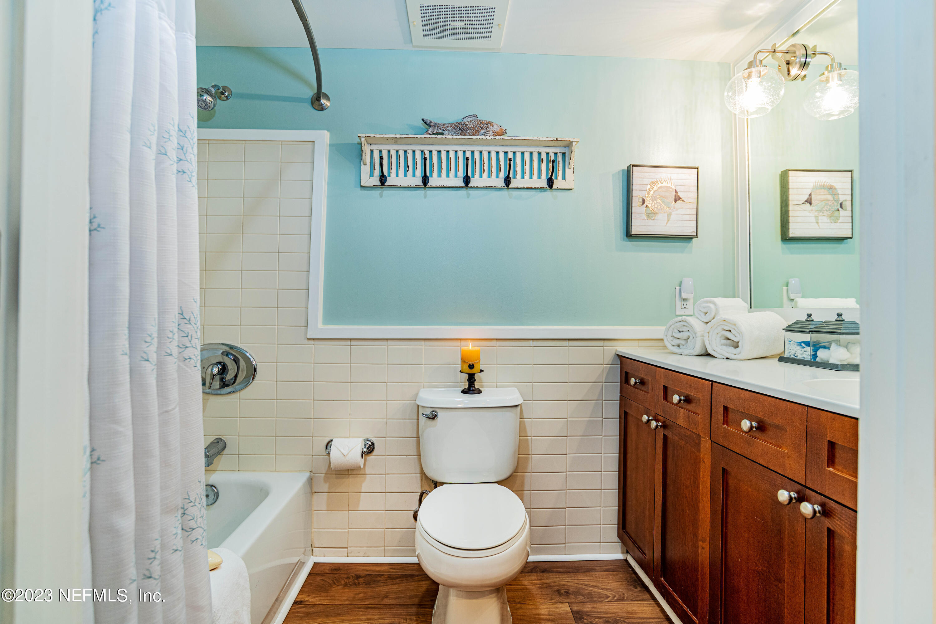 955 Registry Boulevard, Unit 317 St. Augustine, FL 32092 - Photo 12 of 29 a bathroom with a sink a toilet and shower