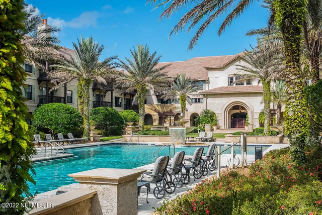 a front view of a house with garden and porch