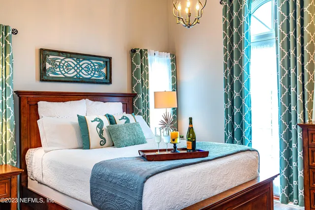 a bedroom with bed and window