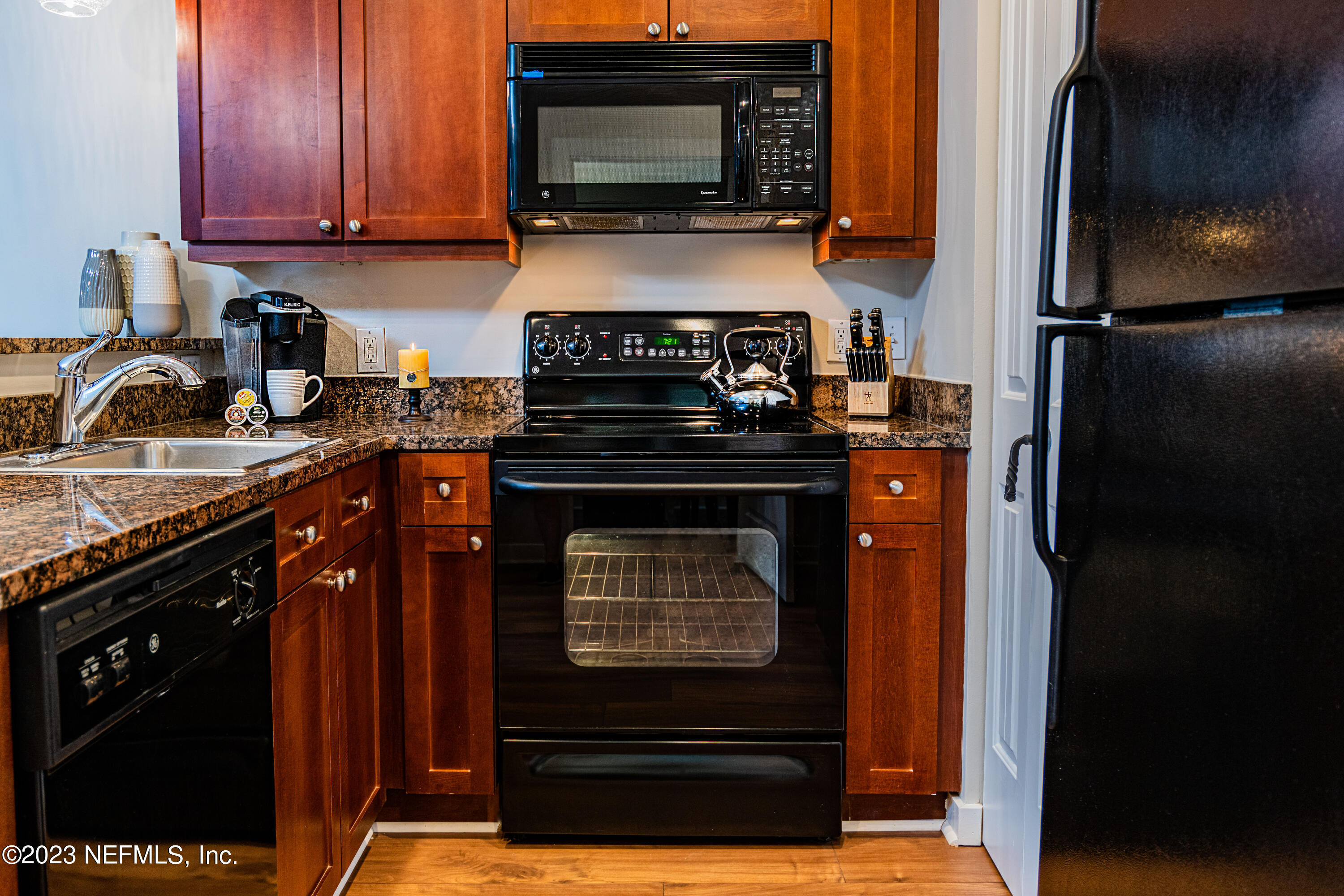 955 Registry Boulevard, Unit 317 St. Augustine, FL 32092 - Photo 8 of 29 a kitchen with a stove and a microwave