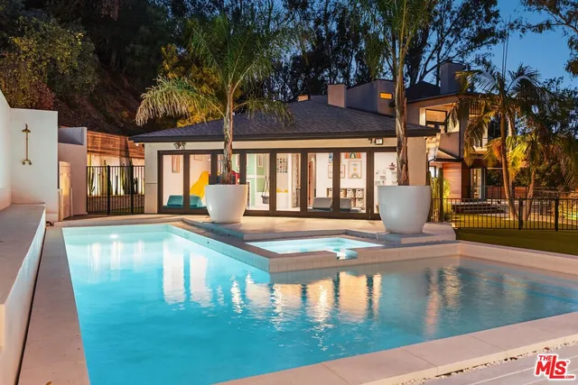 a view of a house with swimming pool