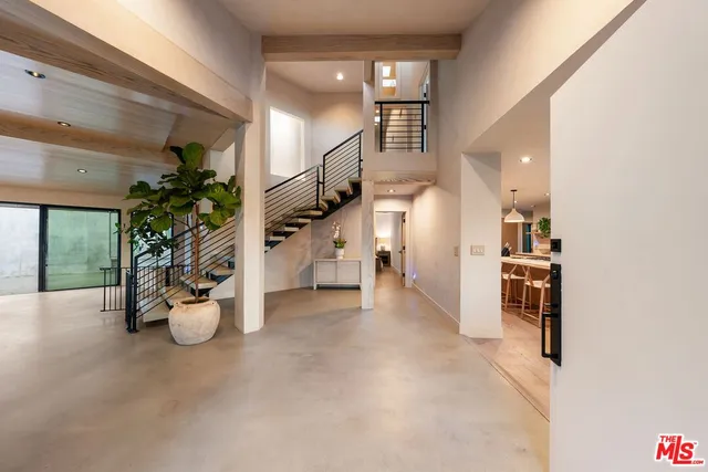 a view of a living room and entryway