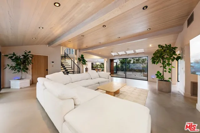 a large white bed in a large room