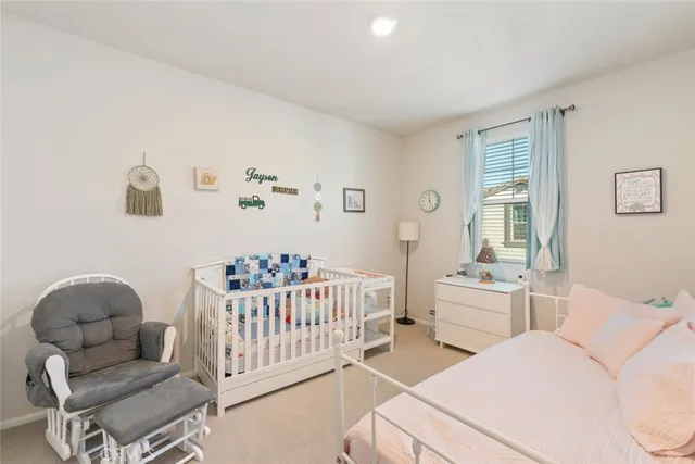 a bedroom with a bed and a chair