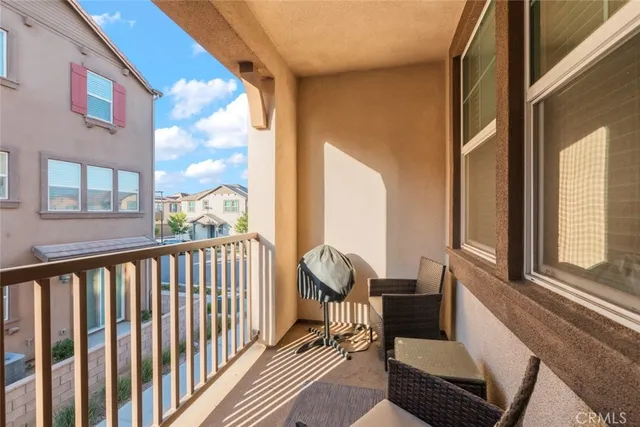 a view of a balcony with furniture