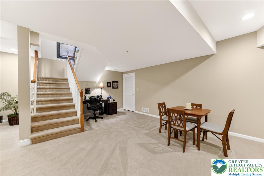5440 Spring Ridge Drive West Macungie, PA 18062 - Photo 32 of 40 A versatile finished lower level with plush carpeting and a convenient office nook awaits your personal touch.