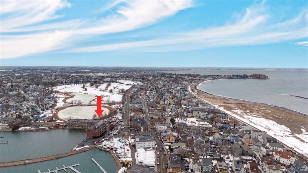 247 Washington, Unit 9 Winthrop, MA 02152 - Photo 15 of 18 a view of roof deck with dining table and chairs