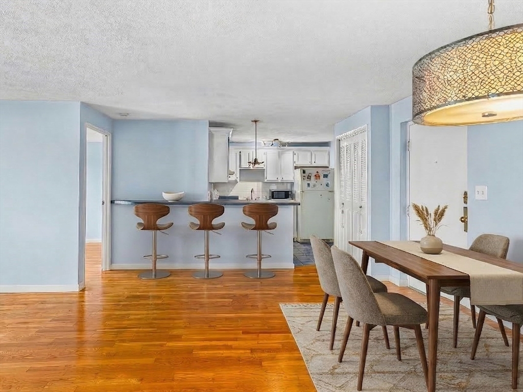 247 Washington, Unit 9 Winthrop, MA 02152 - Photo 3 of 18 a view of a dining room with furniture
