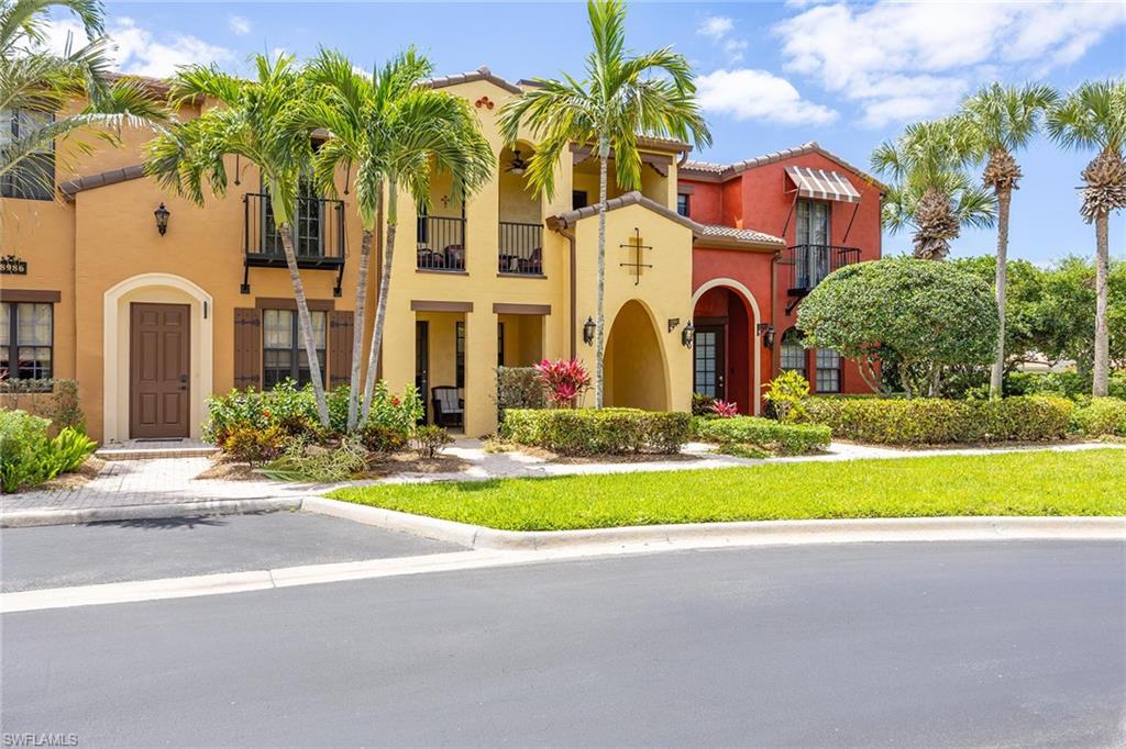 8986 Cambria Circle, Unit 2204 Naples, FL 34113 - Photo 1 of 36 front view of a house with a yard