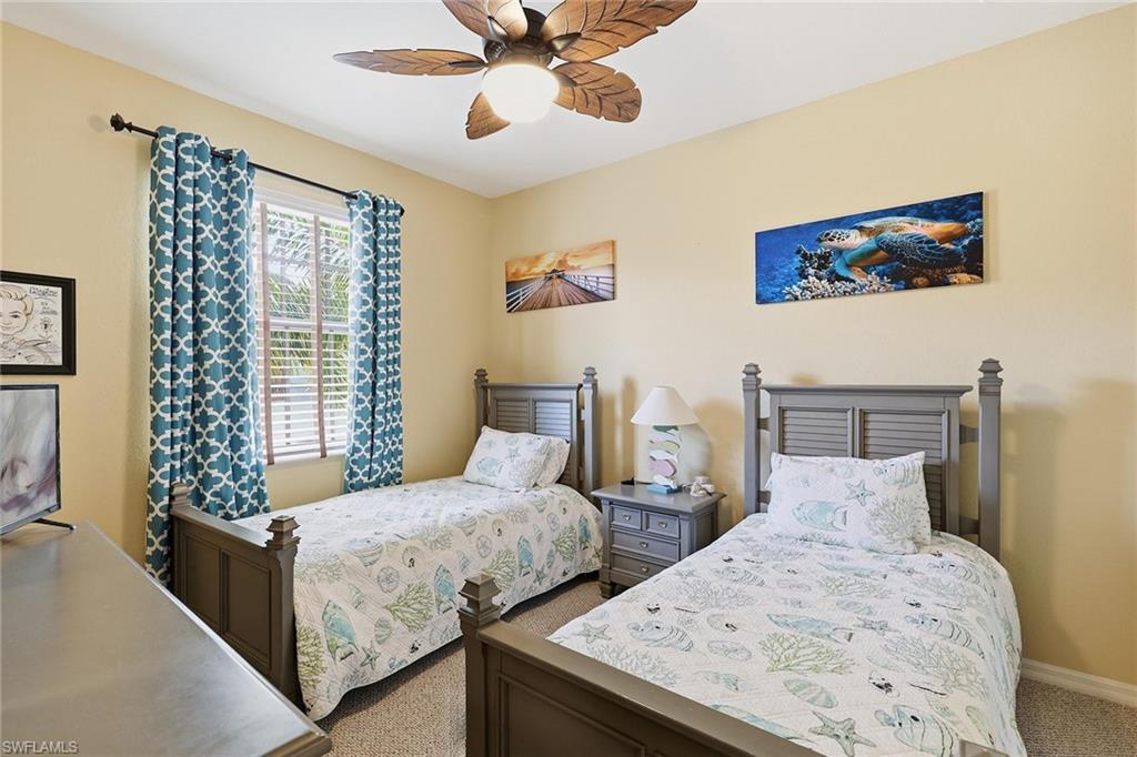 8986 Cambria Circle, Unit 2204 Naples, FL 34113 - Photo 20 of 36 a bedroom with bed and a window