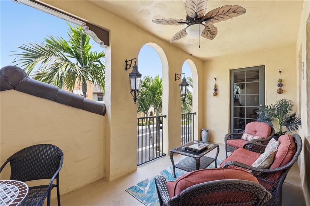 8986 Cambria Circle, Unit 2204 Naples, FL 34113 - Photo 21 of 36 a living room with furniture and a large window