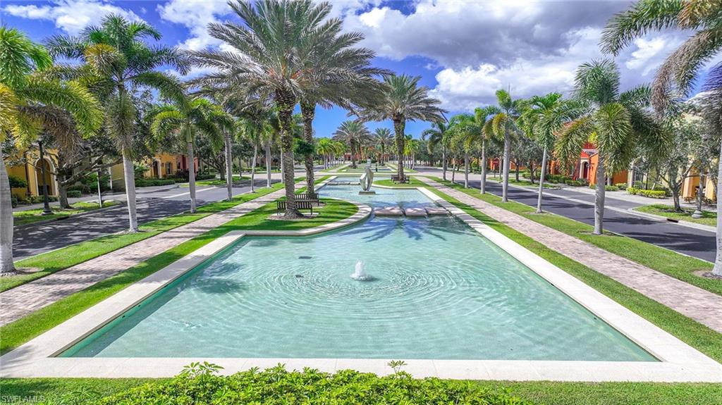 8986 Cambria Circle, Unit 2204 Naples, FL 34113 - Photo 32 of 36 a view of a park with swings and slides