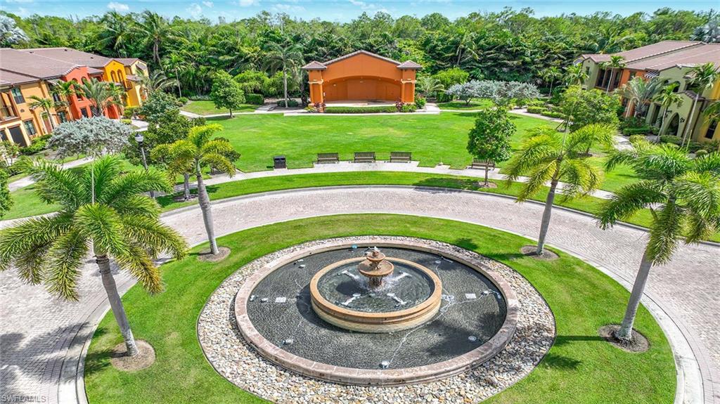 8986 Cambria Circle, Unit 2204 Naples, FL 34113 - Photo 33 of 36 an aerial view of a house with outdoor space and trees all around