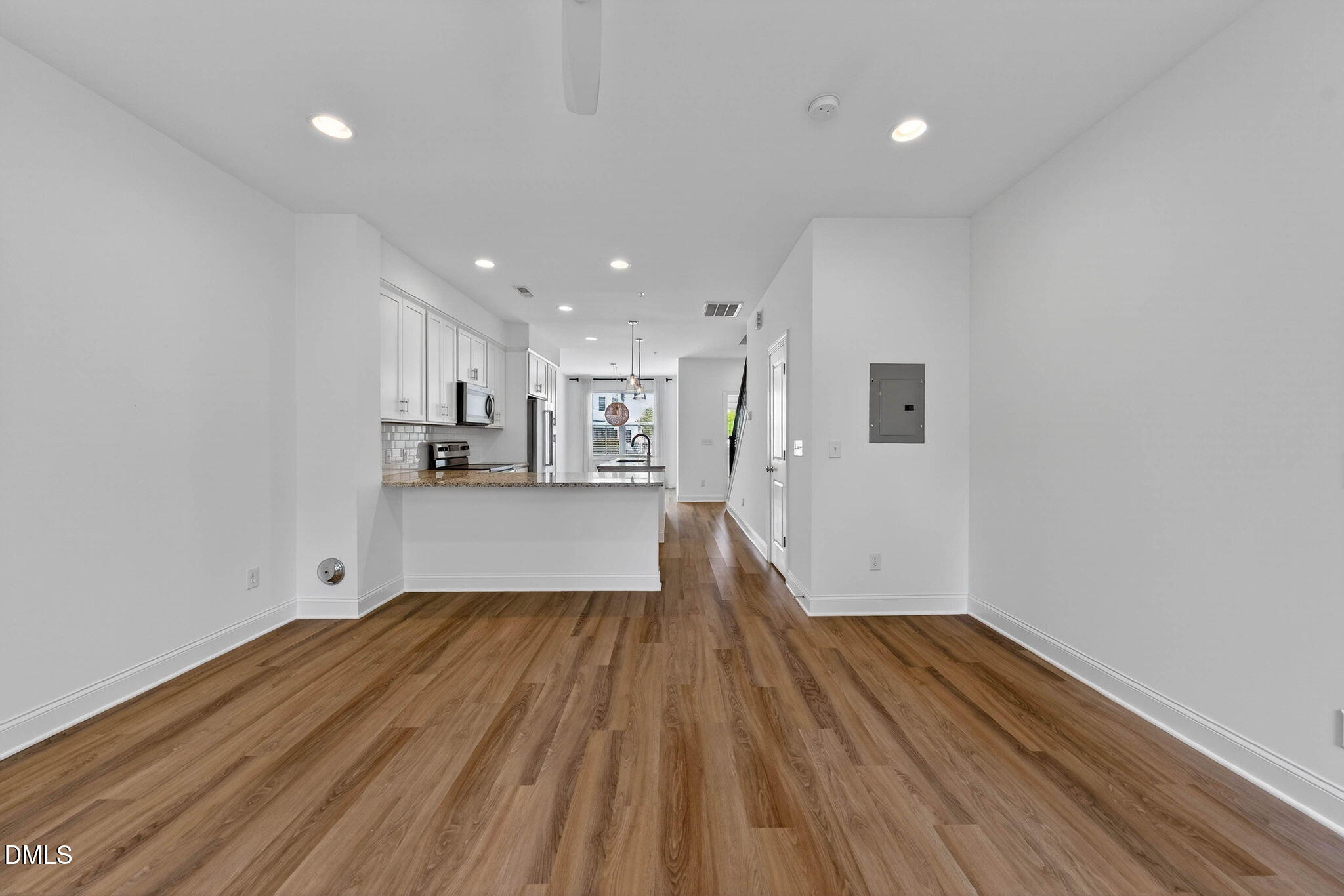 6820 Milligan Way, Unit 104 Raleigh, NC 27613 - Photo 21 of 39 a view of kitchen with wooden floor