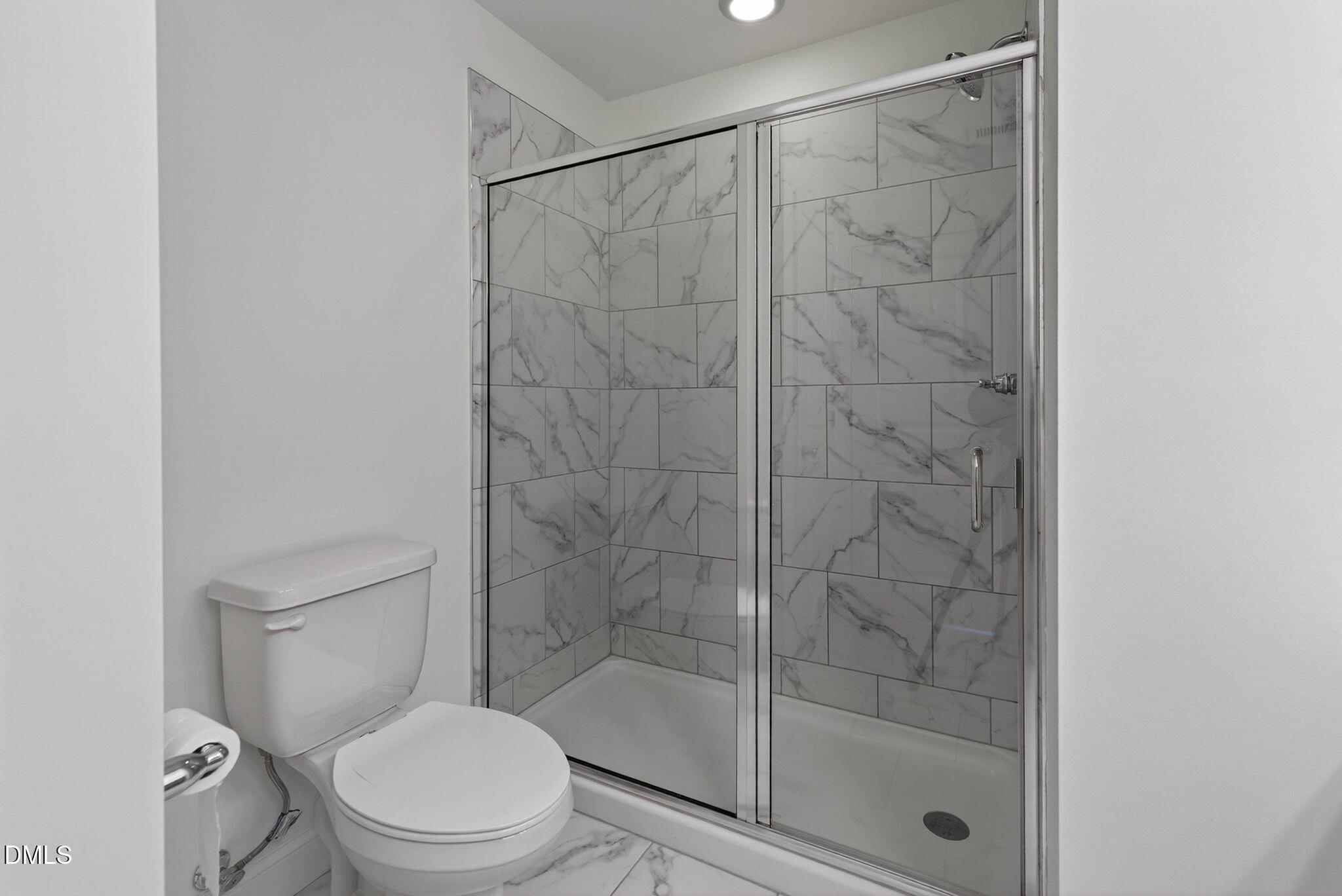 6820 Milligan Way, Unit 104 Raleigh, NC 27613 - Photo 27 of 39 a white toilet next to a bathroom