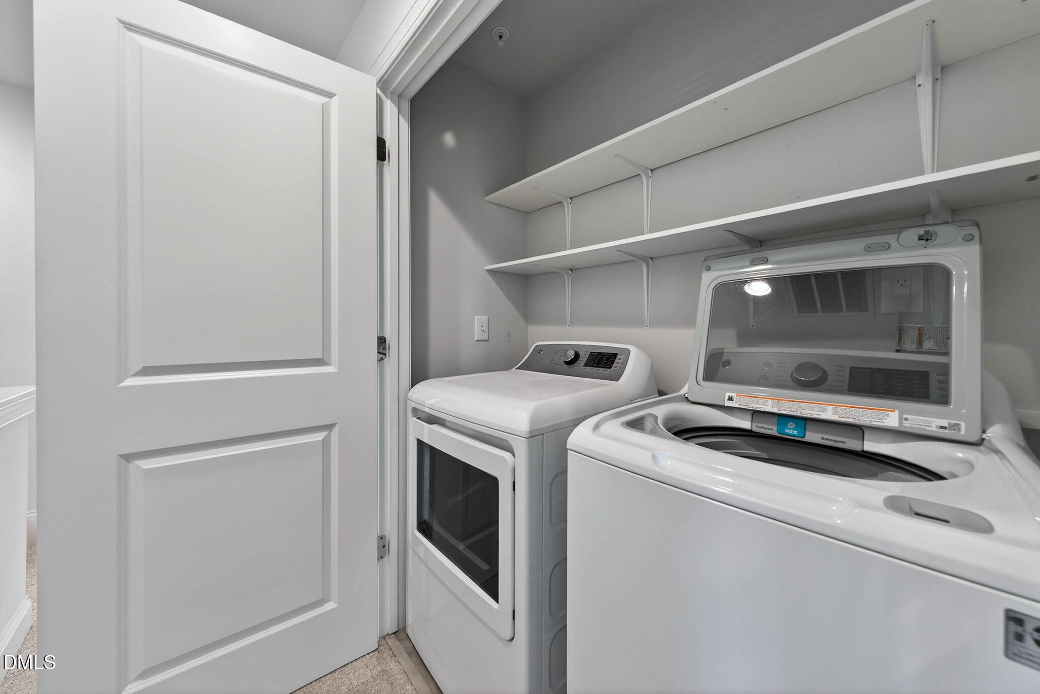 6820 Milligan Way, Unit 104 Raleigh, NC 27613 - Photo 28 of 39 a utility room with dryer and washer