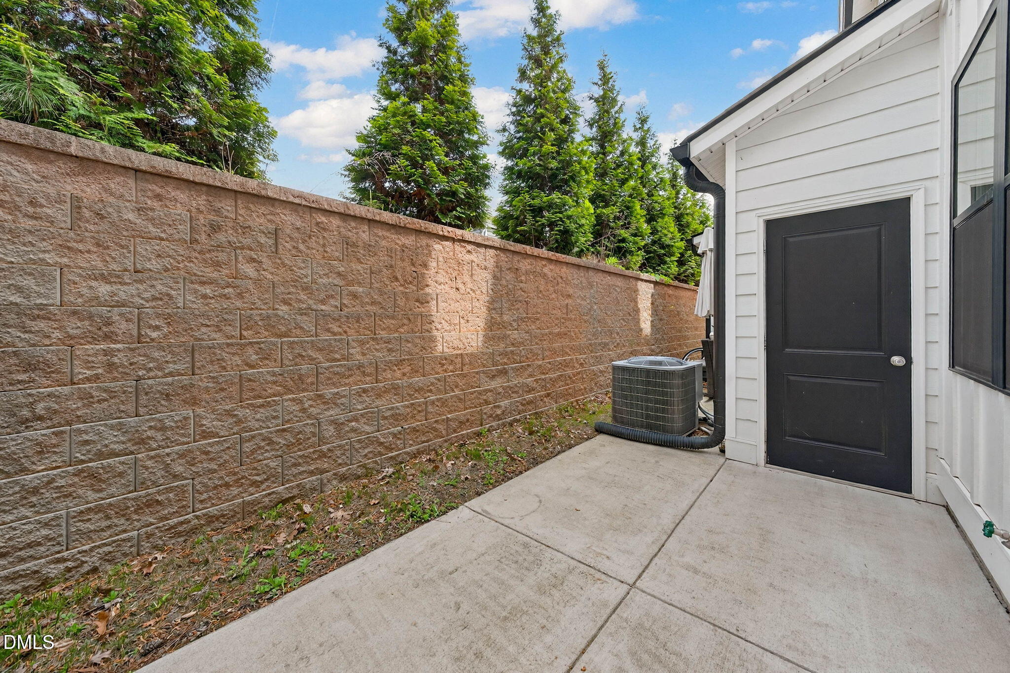 6820 Milligan Way, Unit 104 Raleigh, NC 27613 - Photo 30 of 39 a view of a pathway with a wall