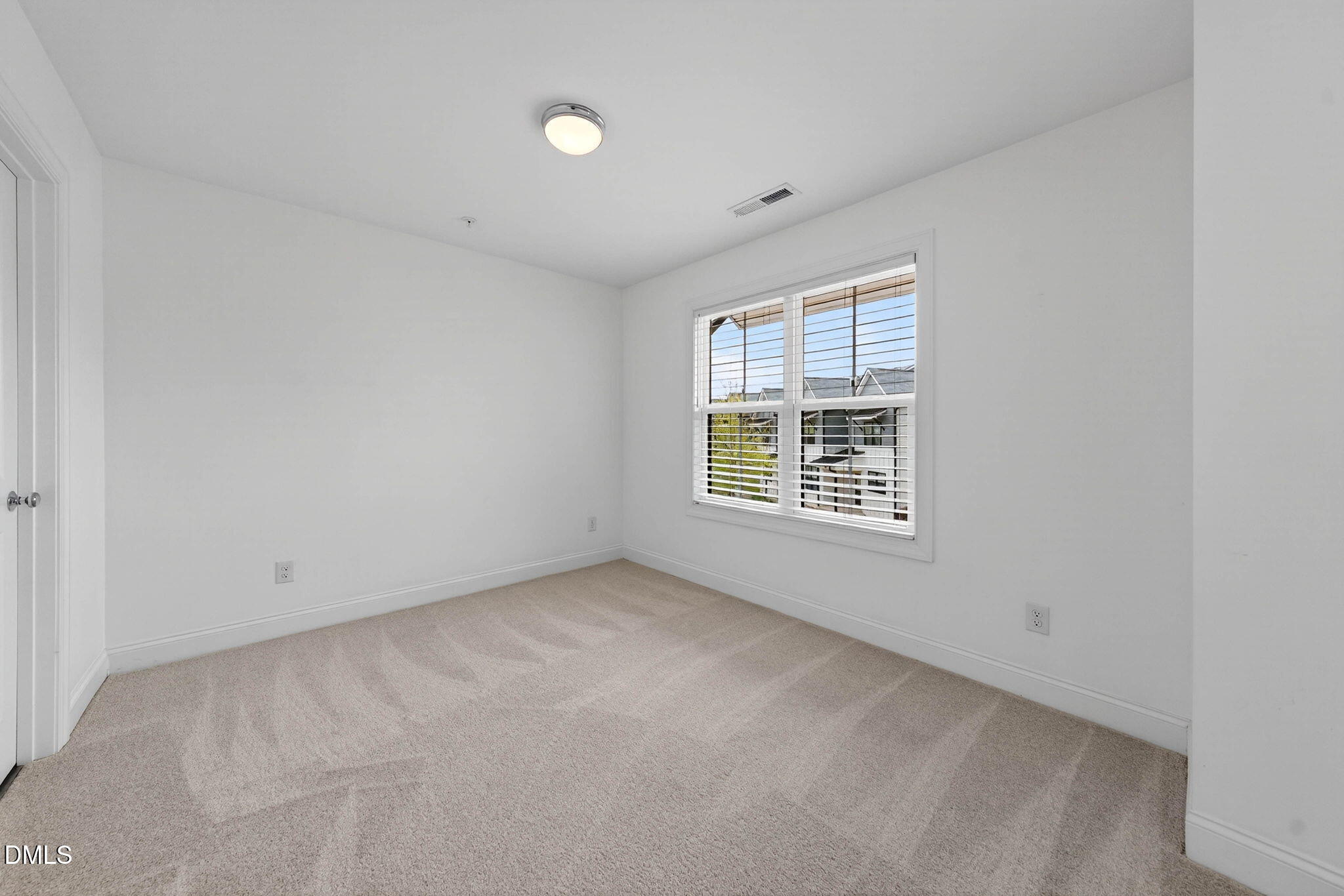 6820 Milligan Way, Unit 104 Raleigh, NC 27613 - Photo 32 of 39 an empty room with a window