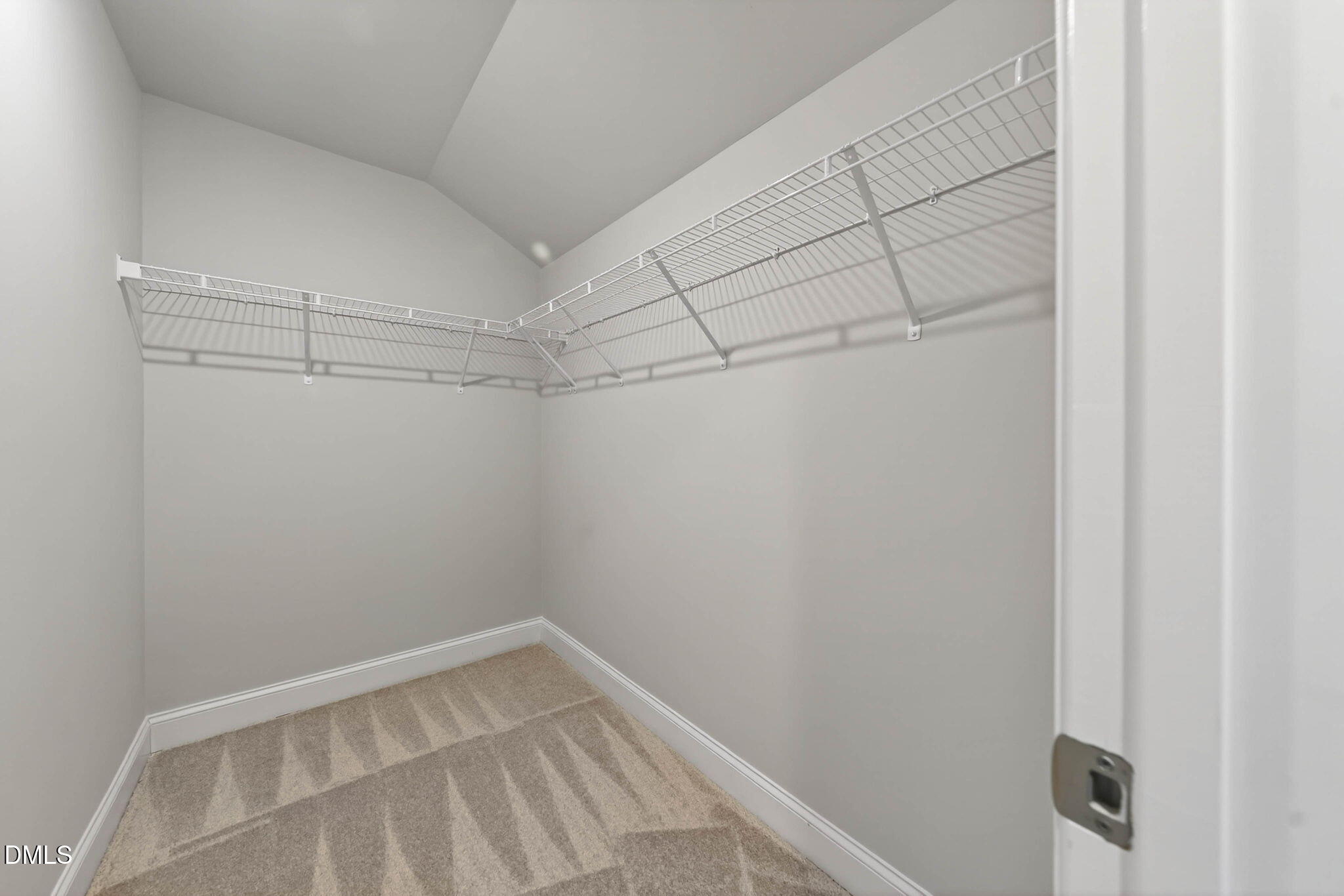 6820 Milligan Way, Unit 104 Raleigh, NC 27613 - Photo 36 of 39 a view of a room with racks on the wall