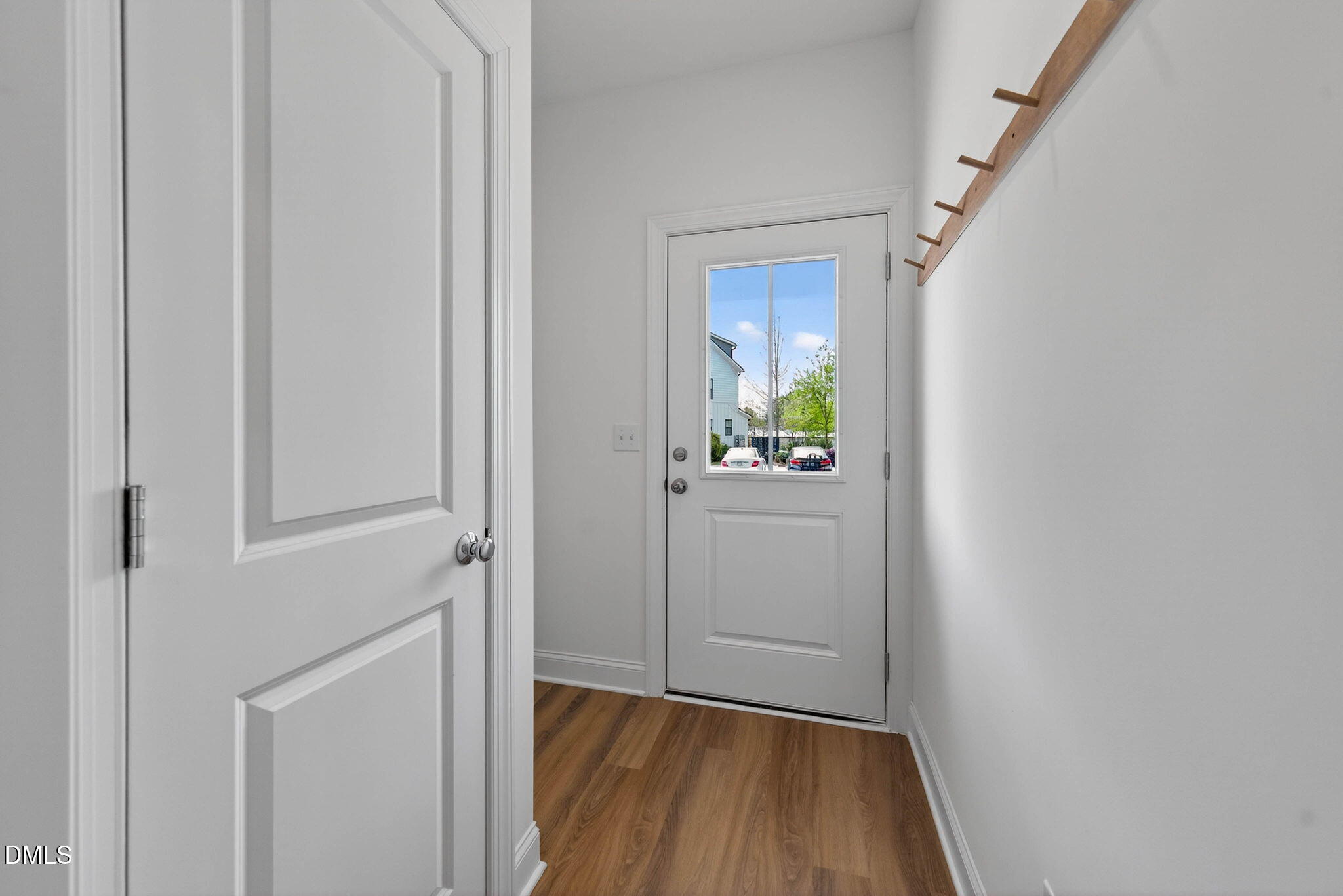 6820 Milligan Way, Unit 104 Raleigh, NC 27613 - Photo 5 of 39 a view of an entryway with wooden floor