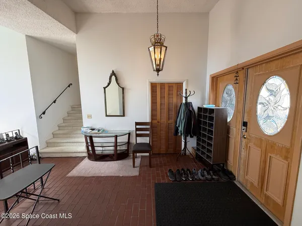 a view of living room with furniture and wooden floor