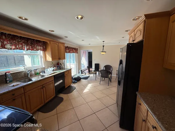 a kitchen with stainless steel appliances a refrigerator and a sink