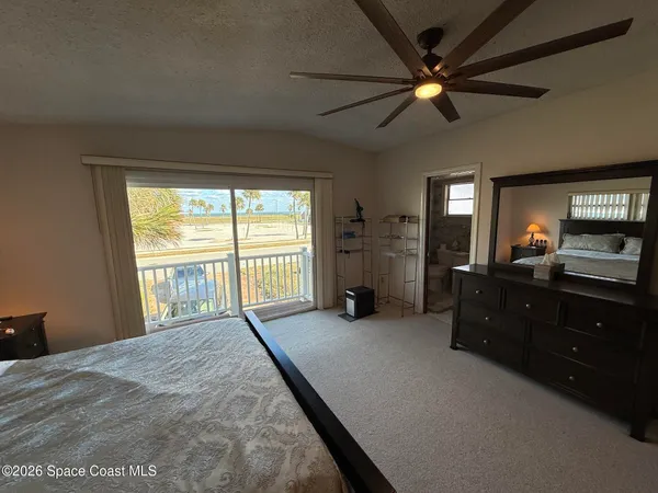 a bed room with a bed and a television