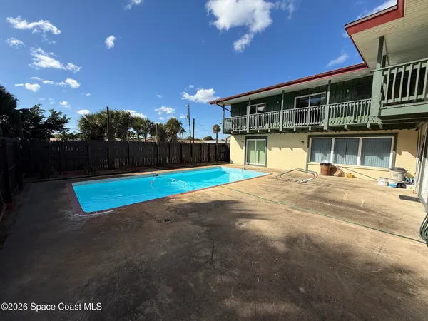 a view of a house with a swimming pool