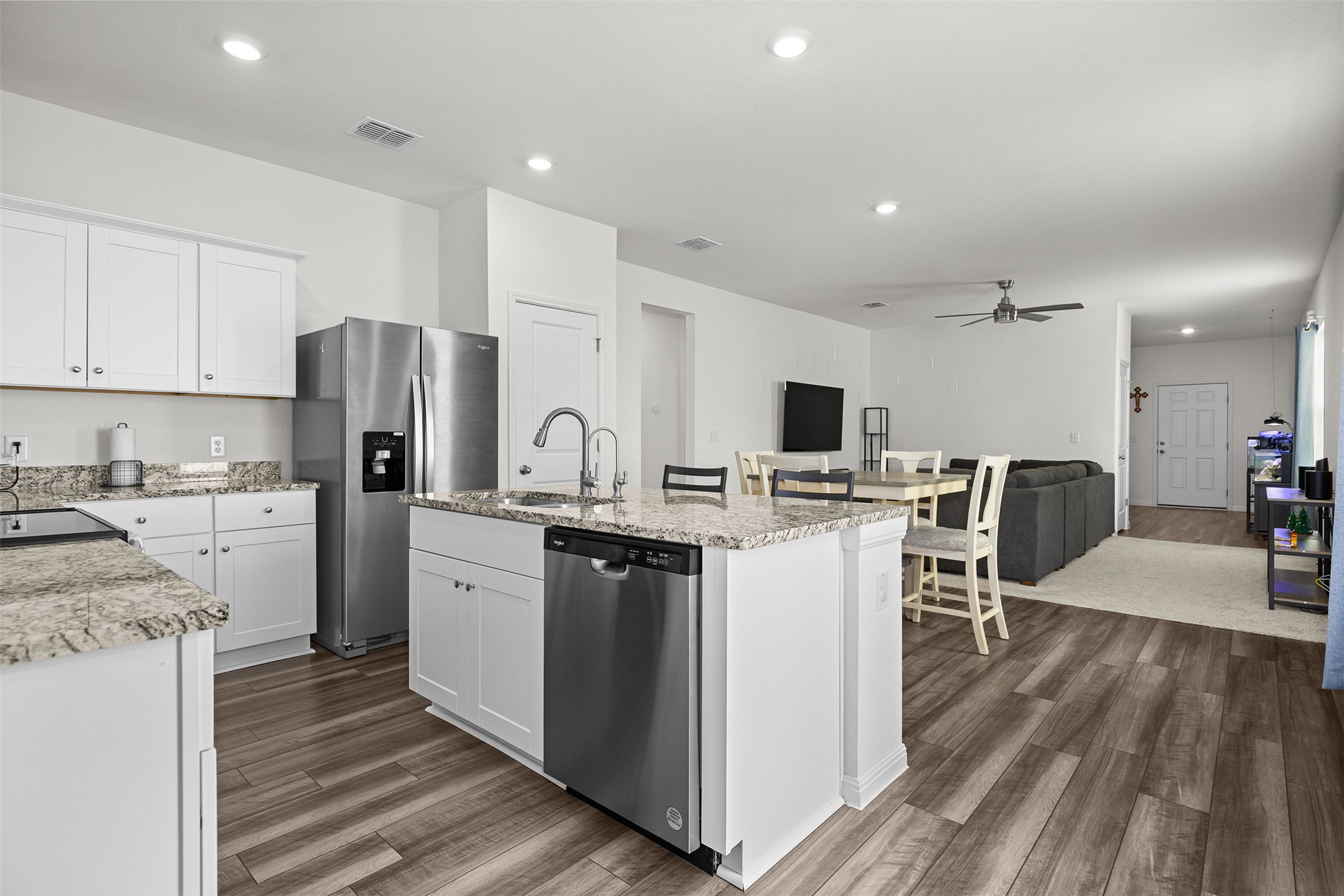 104 Enforcer Loop Jarrell, TX 76537 - Photo 5 of 12 a kitchen with stainless steel appliances a refrigerator stove microwave and cabinets