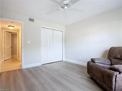 a room with furniture and wooden floor