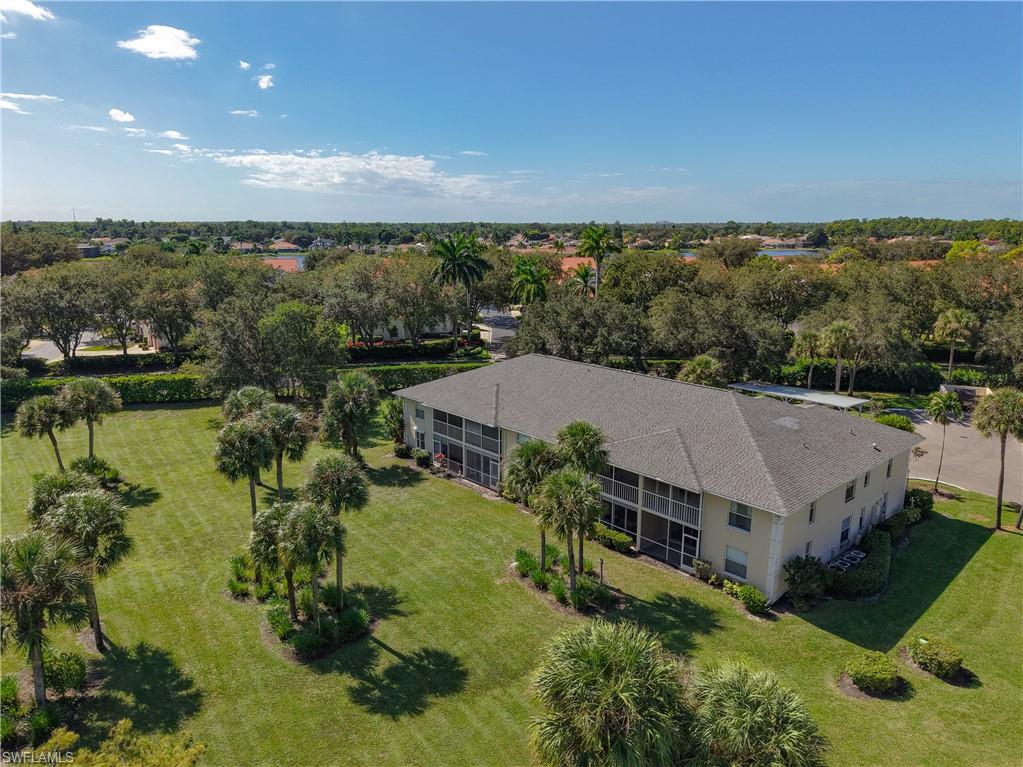 729 Landover Court, Unit 102 Naples, FL 34104 - Photo 21 of 28 an aerial view of house with yard and mountain view