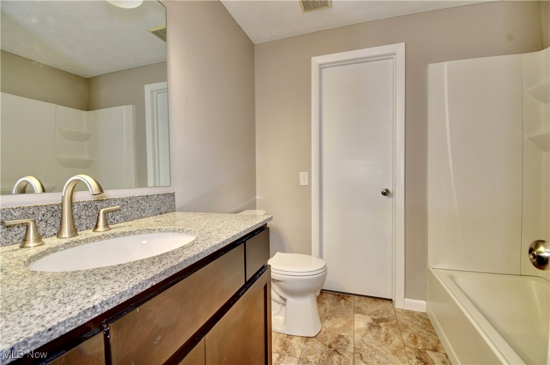 494 Moore Road Akron, OH 44319 - Photo 13 of 30 Full bathroom with toilet, shower / bathtub combination, vanity, and visible vents