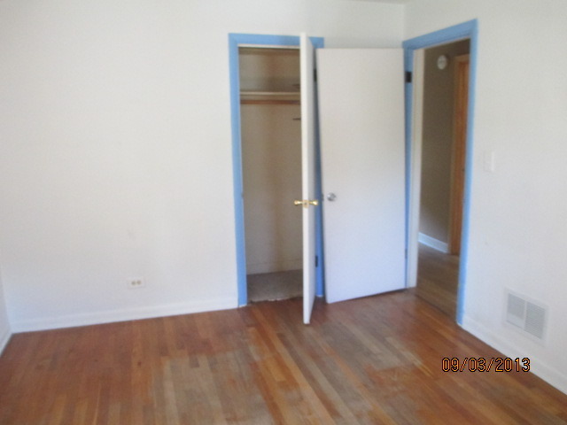 432 Harding Avenue Des Plaines, IL 60016 - Photo 15 of 20 an empty room with wooden floor and closet