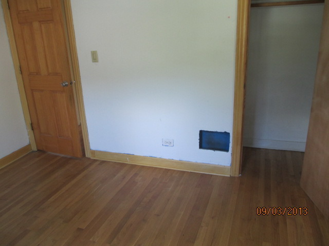 432 Harding Avenue Des Plaines, IL 60016 - Photo 17 of 20 a view of an empty room with wooden floor