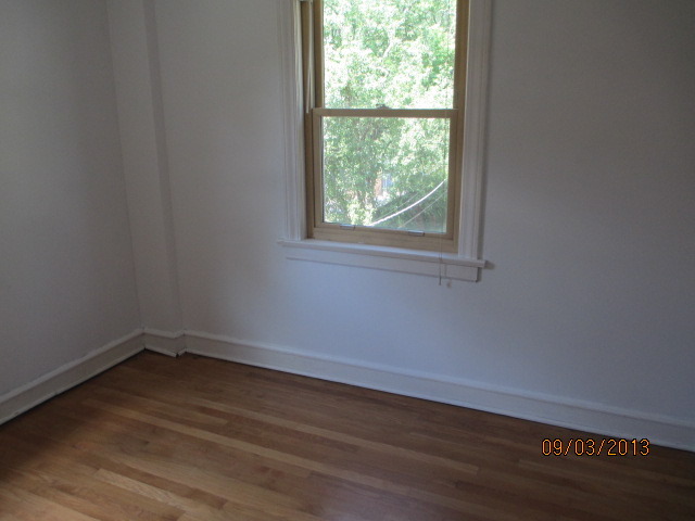 432 Harding Avenue Des Plaines, IL 60016 - Photo 18 of 20 an empty room with wooden floor and windows